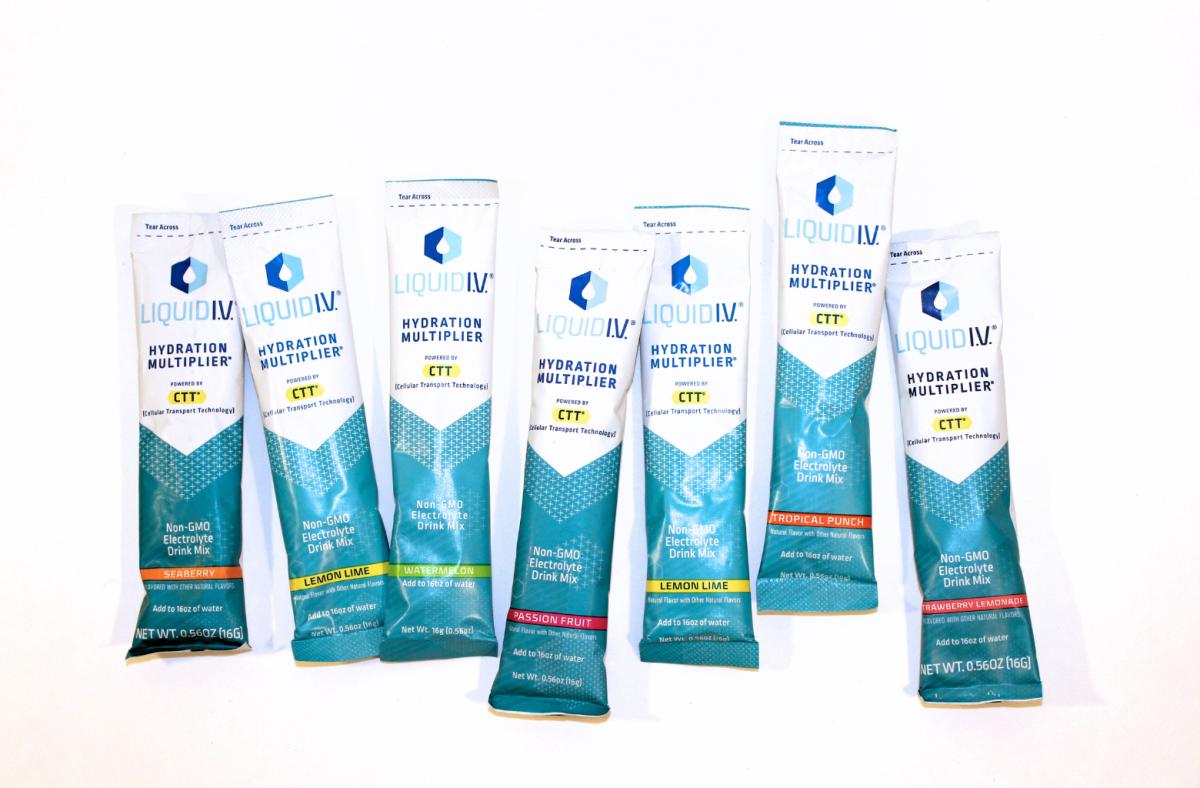 Liquid IV electrolyte travel packs in various flavors against a white background